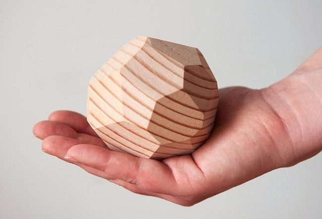 Geometric Wood Forms In Hand