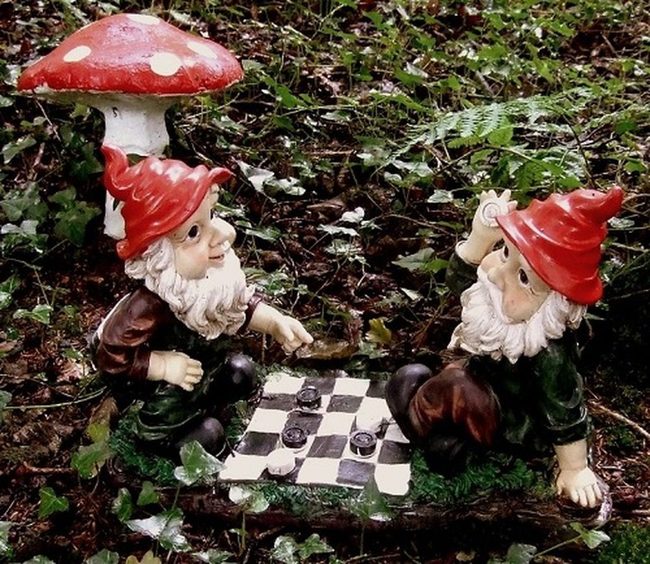 Ceramic Gnomes Playing Board Games