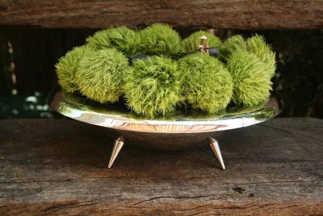 Green Spheres On Silver Pedestals