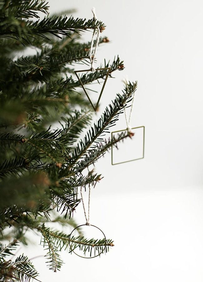 Geometric Metal Ornaments On Green Pine