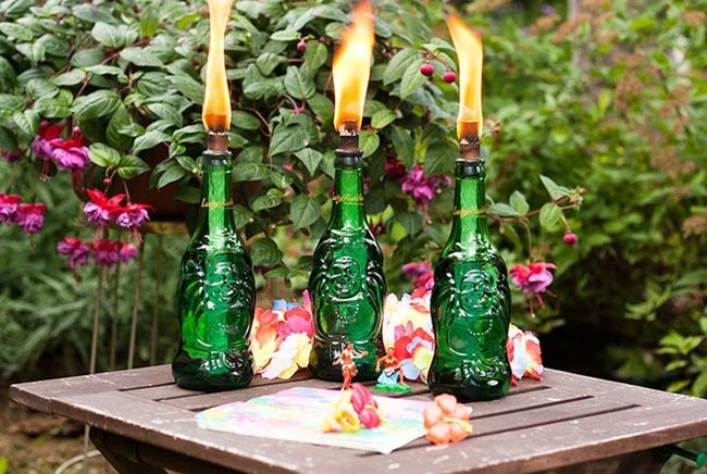 Candlelit Green Glass And Pink Blooms