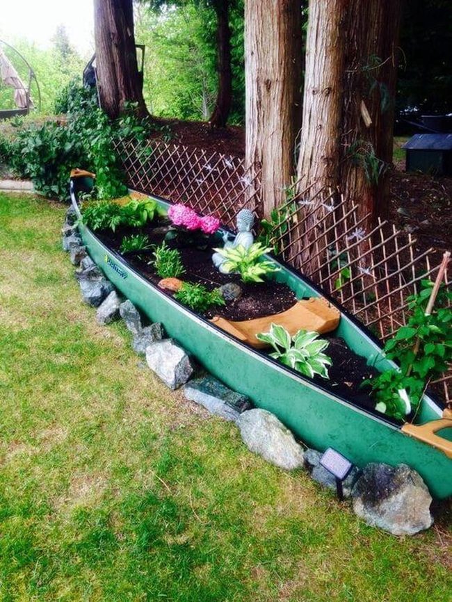 Canoe Planter Bursting With Blooms