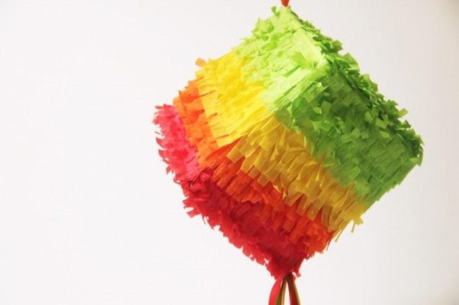 Colorful Paper Piñatas Bursting Candy