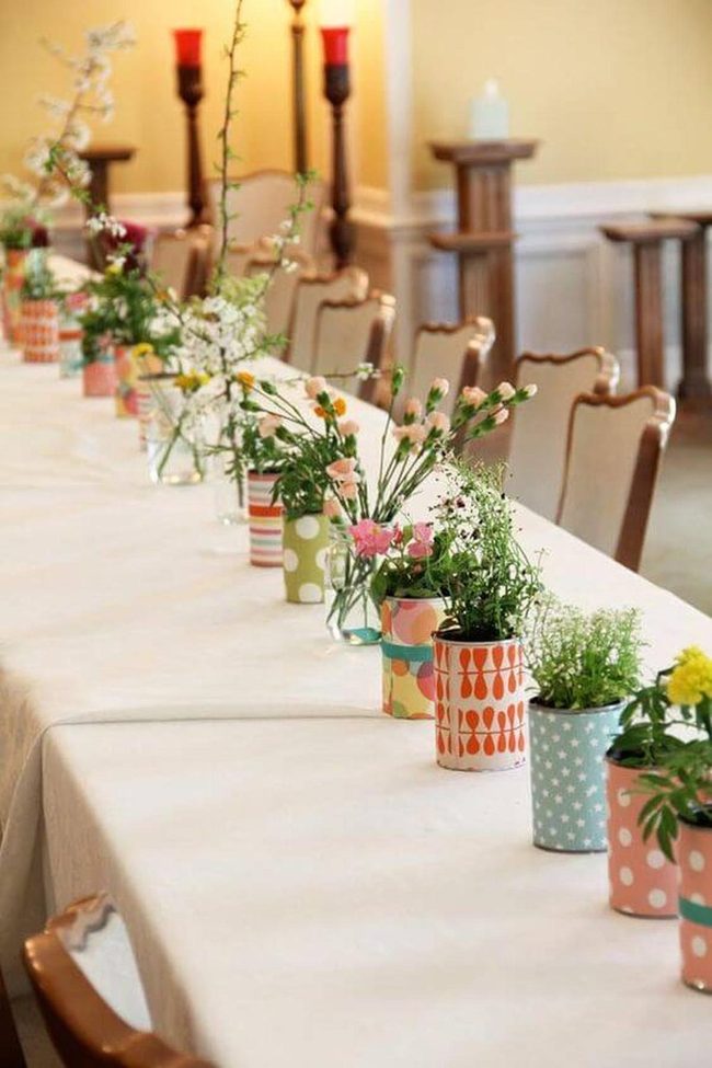Painted Cans Overflowing With Spring Blooms