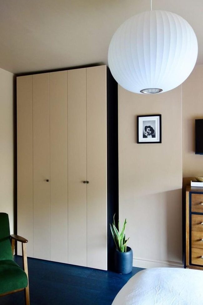Deep Blue Floor Anchors Neutral Bedroom
