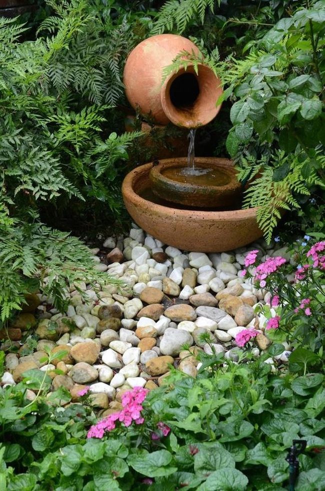 Pink Flowers Cascade Through Terracotta