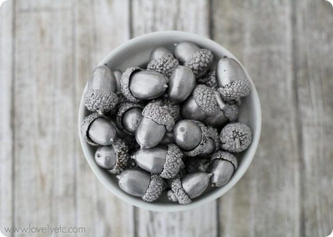 Silver Acorns On Wood