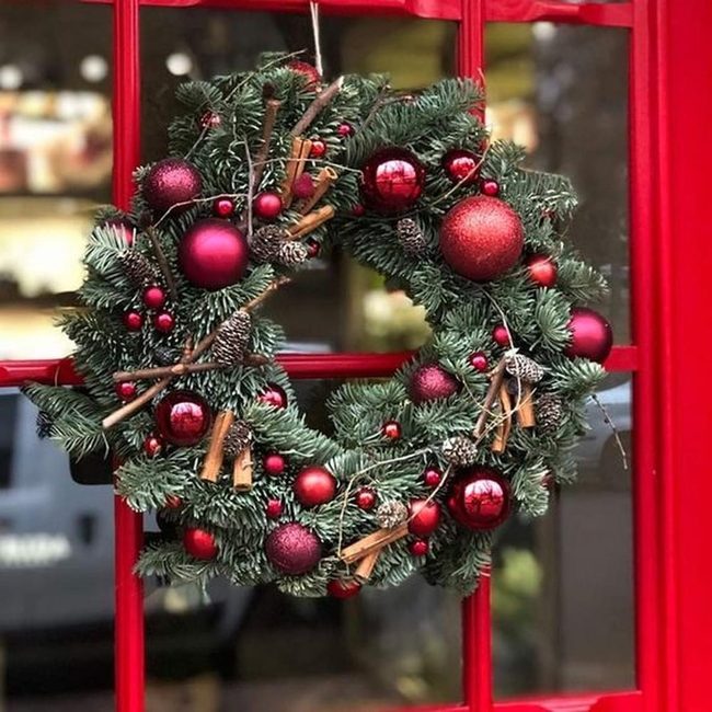 Red Ornaments Against Deep Green
