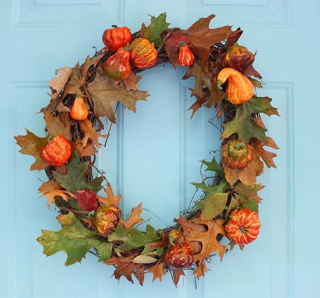Orange Gourds Against Blue Door