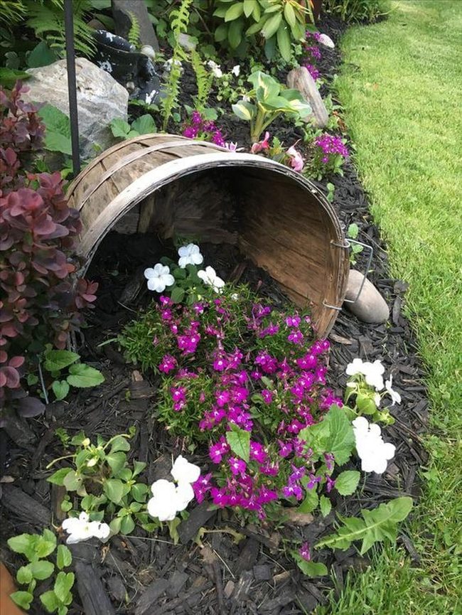 Overturned Bucket Spilling Pink Blooms