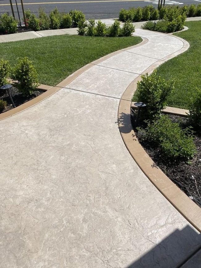Curved Concrete Path Through Green