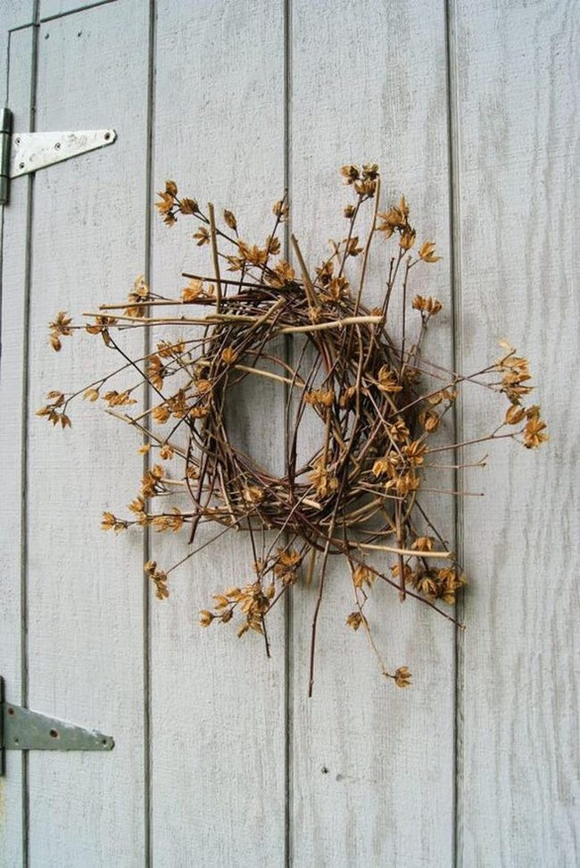 Weathered Gray Door With Branch Wreath