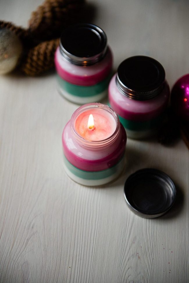 Layered Pastel Candles With Pinecones