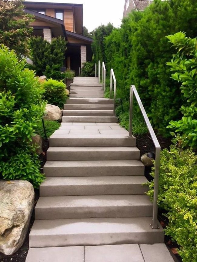 Concrete Steps Through Green Landscape