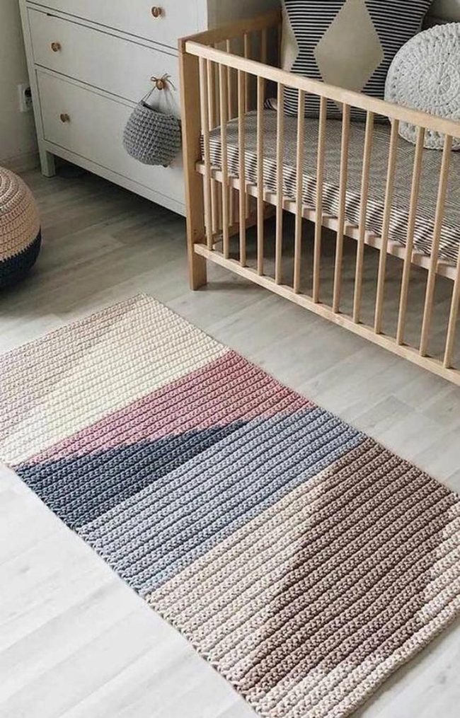 Light Wood Crib With Striped Cushions