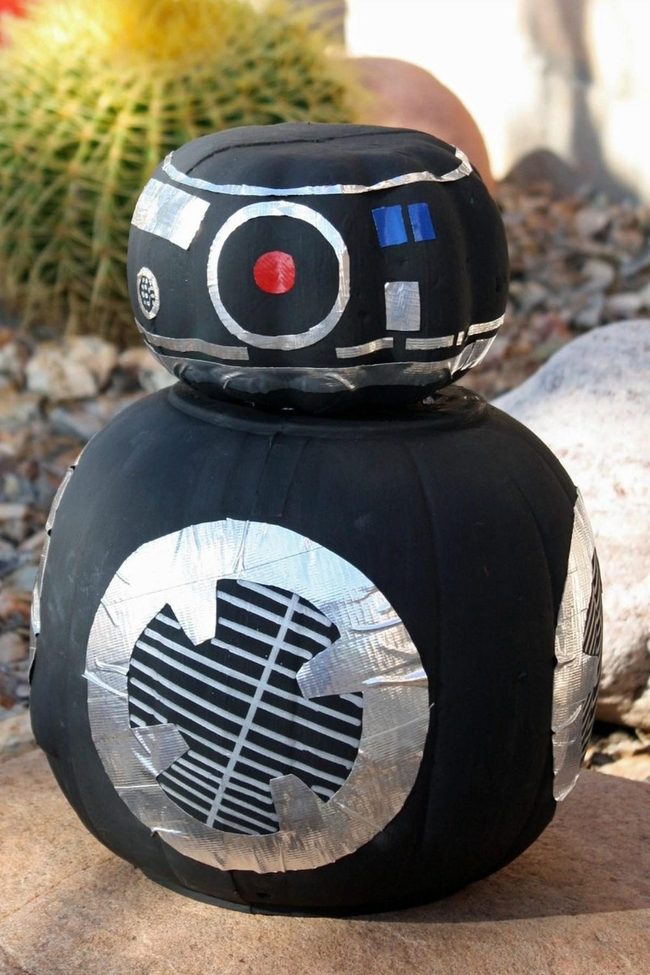 Silver-Striped Robot In Desert Sand