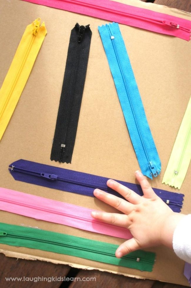 Colorful Metal Zippers On Cardboard