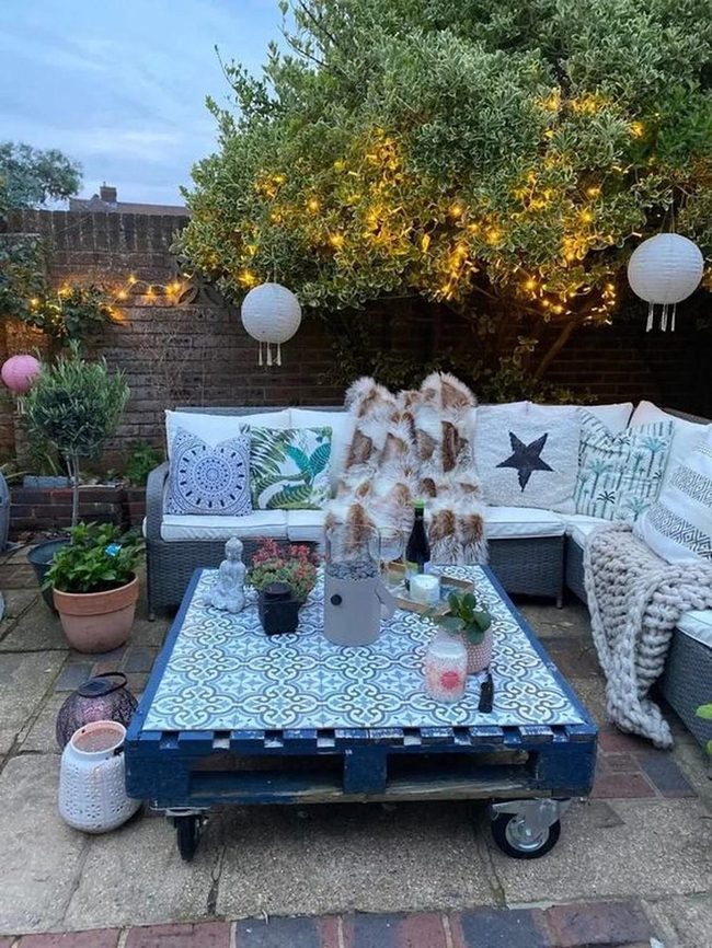 String Lights Over Gray Wicker