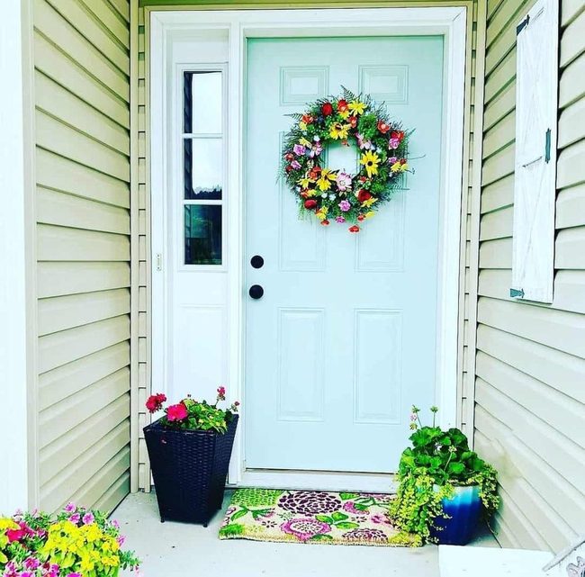 Light Blue Door With Colorful Floral Wreath