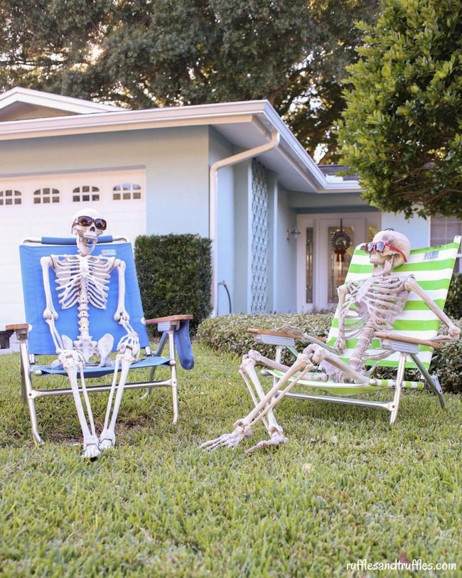 Skeleton Sunbathers In Lawn Chairs