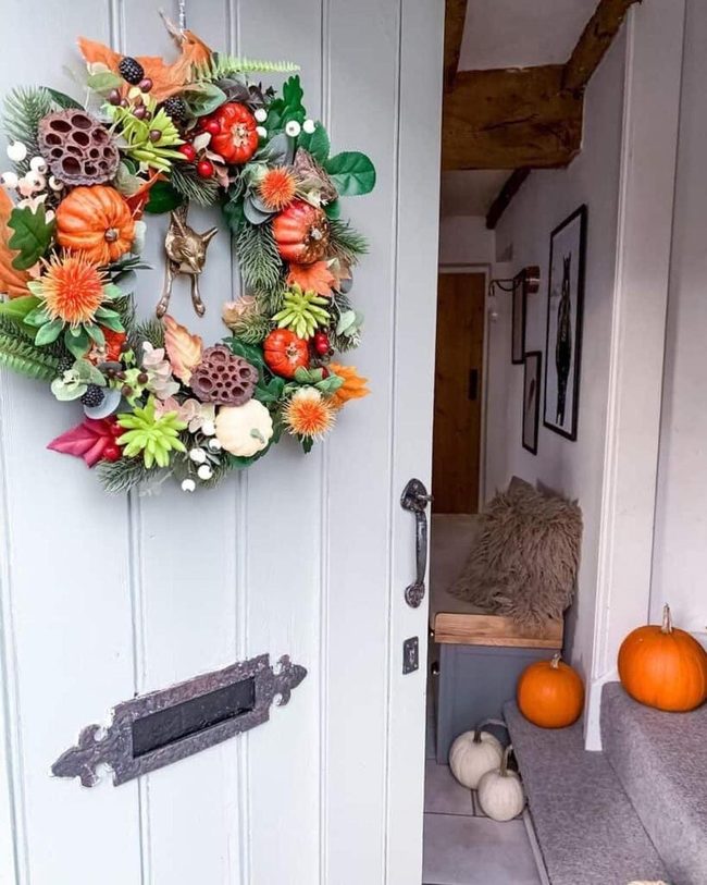 Orange Pumpkins Meet Crimson Berries