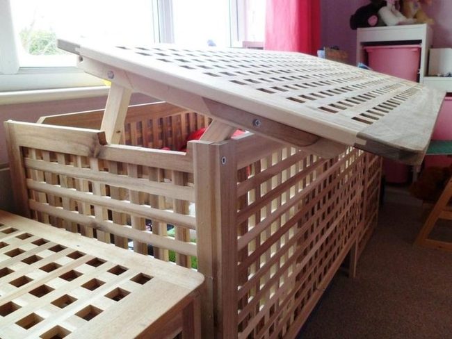 Light Wood Playpen With Pink Accents