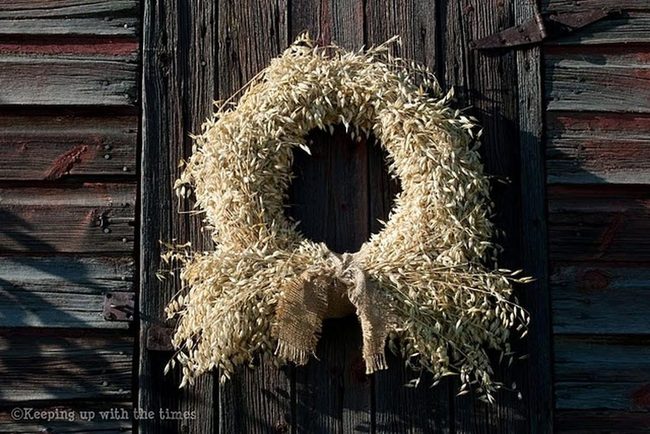 Dried Wreaths On Faded Red Doors