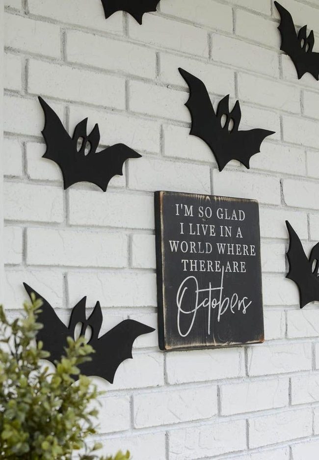 Black Bats On White Brick