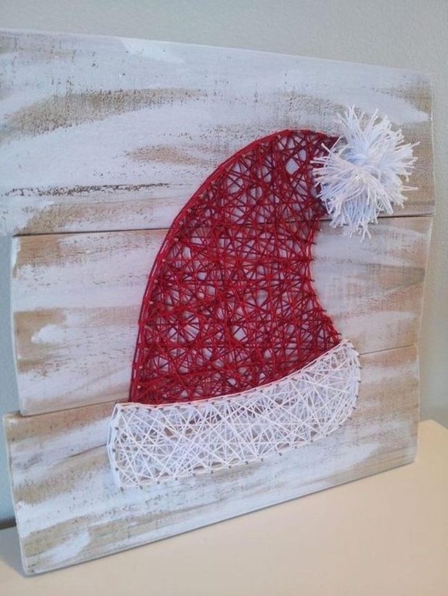 Red String Santa Hat On Whitewashed Wood