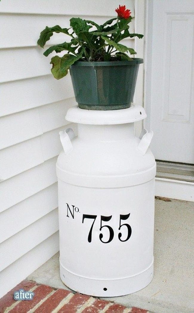 Green Metal Jugs With Plants