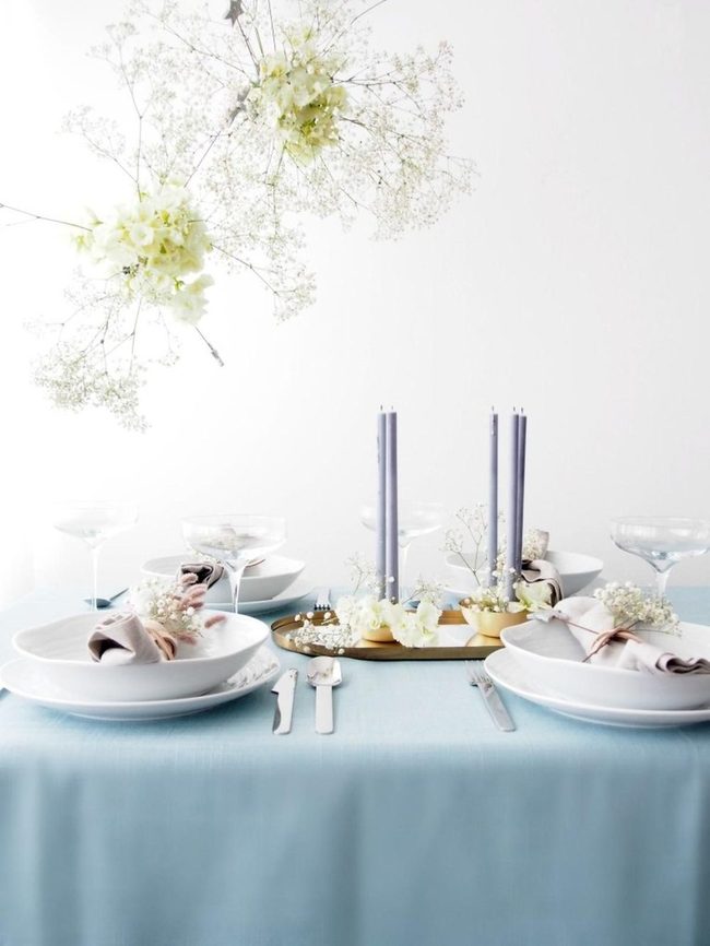 Floating Blossoms Over Blue Table