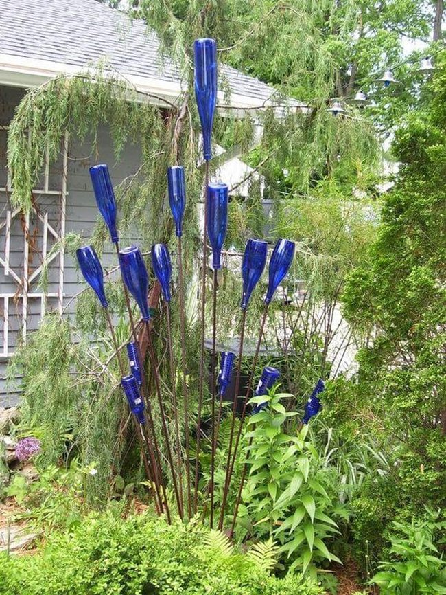 Blue Glass Garden Sculptures Cast Colored Shadows