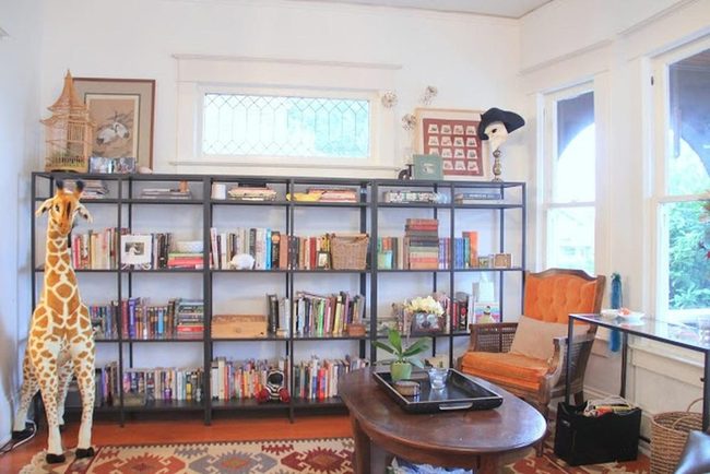 Black Bookshelf Bursting With Color