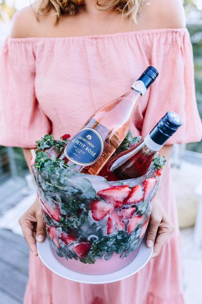 Pink Wine Bottles With Frozen Strawberries