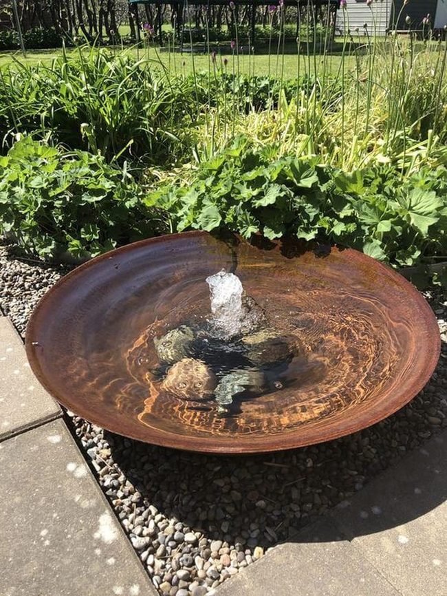 Rust Metal Basin With Flowing Water