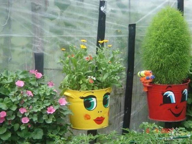 Painted Buckets Overflow With Blooms
