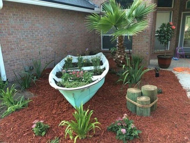 Overflowing Boat Garden With Cascading Greens