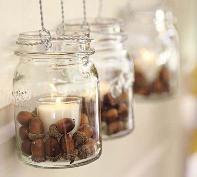 Acorns And Candlelight In Glass