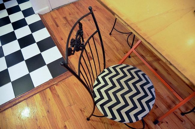 Black And White Checkered Floor Meets Warm Wood