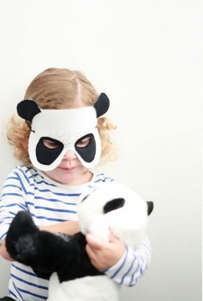 Child With Panda Mask And Stuffed Friend
