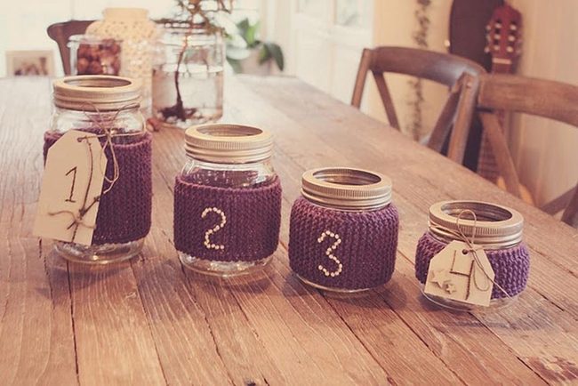 Purple Knitted Jar Covers And Wood