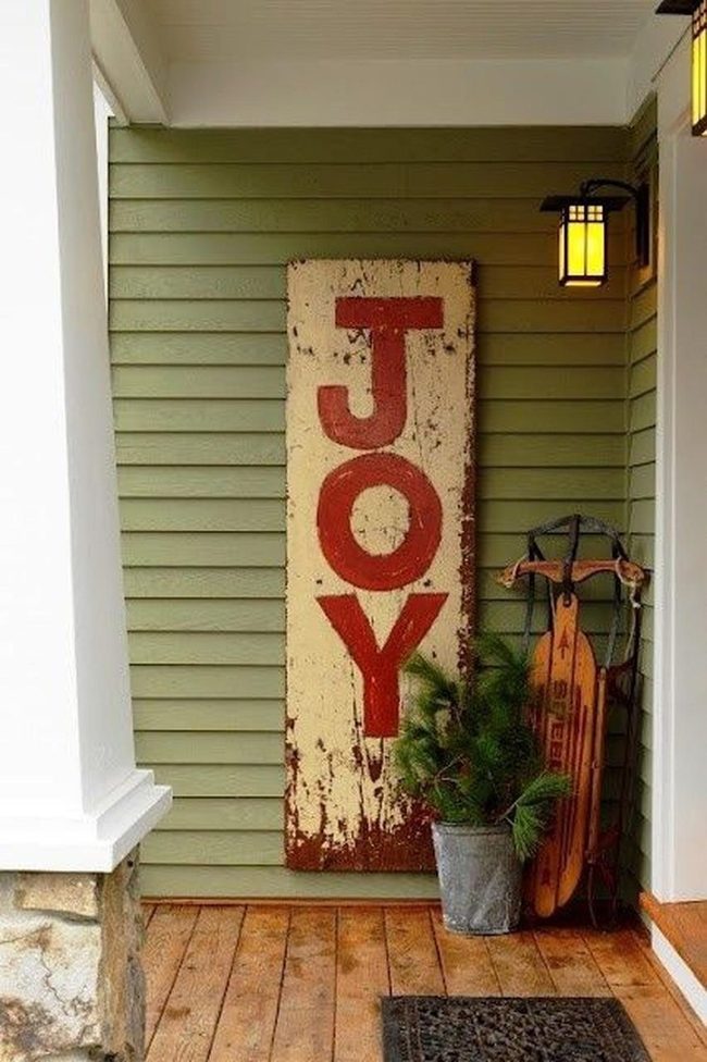 Red Joy Sign On Green Porch