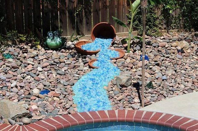 Bright Blue Stones Cascading From Terracotta