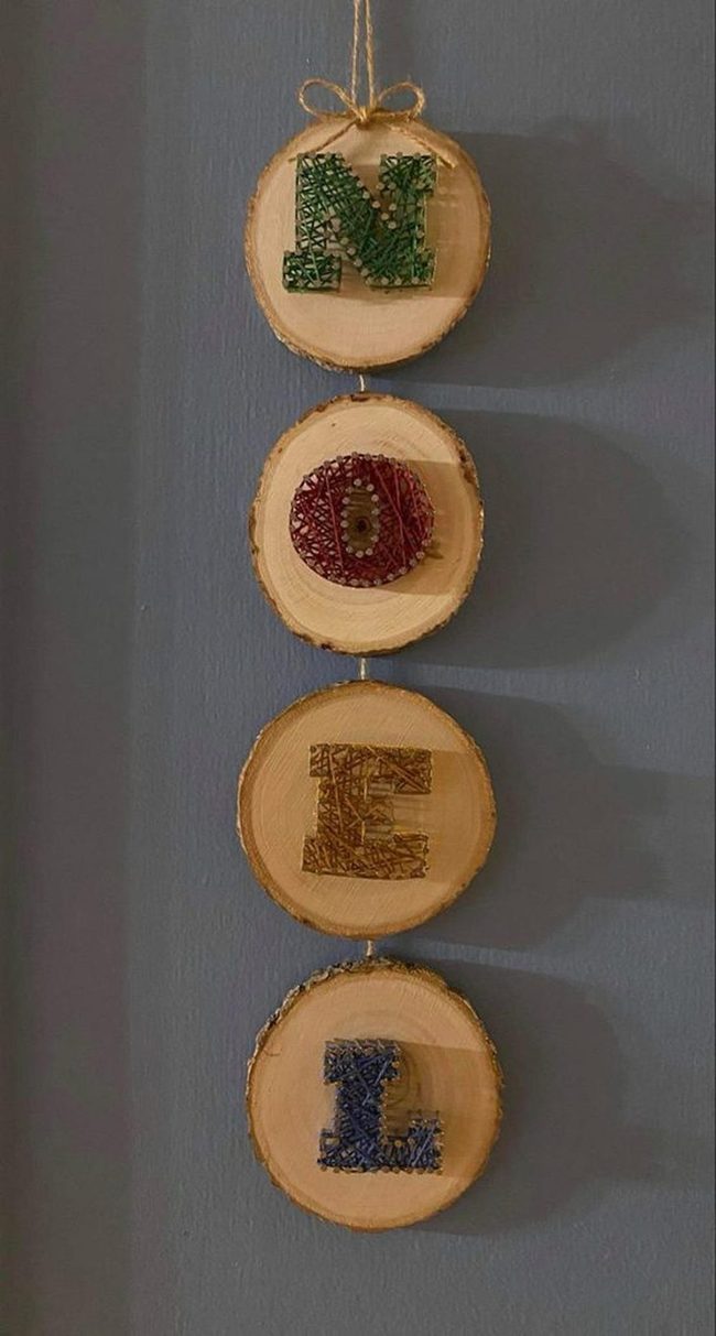 Multicolored String Letters On Wood