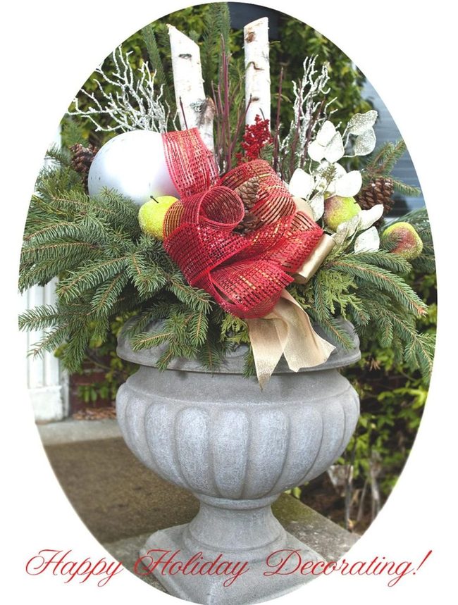 Stone Urns With Red Ribbons And Pine