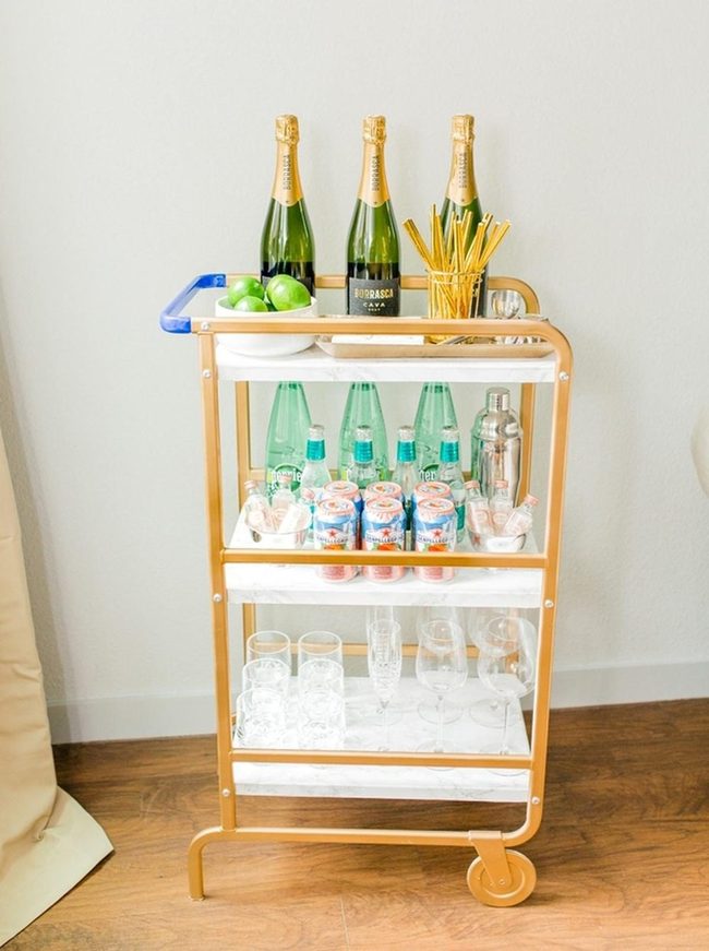 Gold Frame Bar Cart With Green Bottles