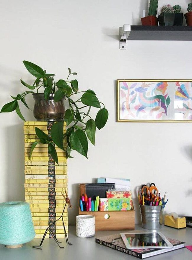 Books And Cascading Greenery Display