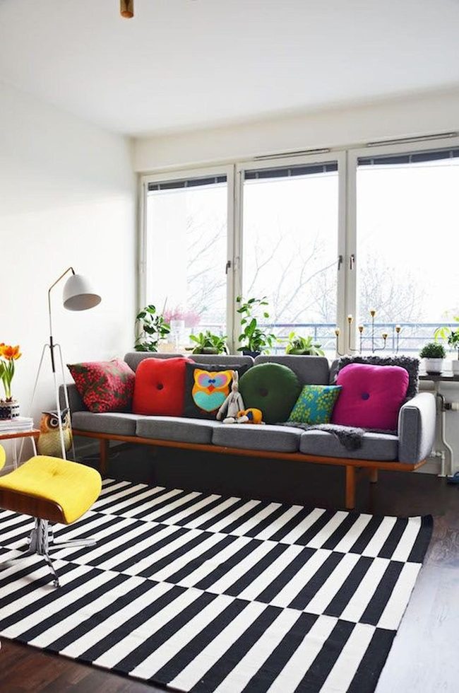 Gray Sofa, Rainbow Pillows, Striped Rug