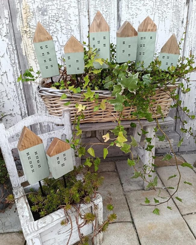 Green Wooden Houses Among Living Plants