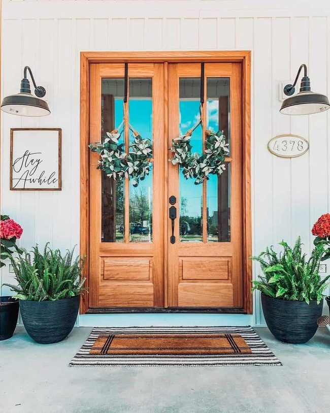 Green Wreaths Warm Wood Doors